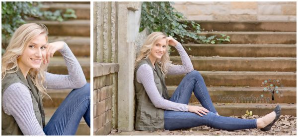 Beautiful blonde high school graduate in denim and soft green vest seated in front of stone staircase