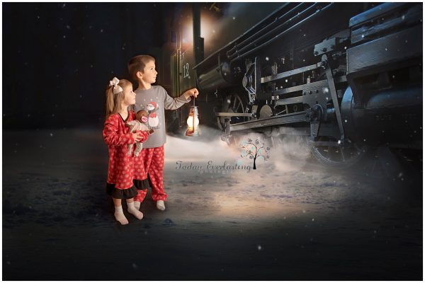 Young children holding a lantern in front of the Polar Express